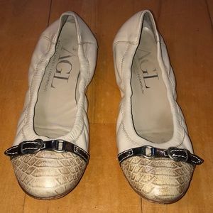 AGL leather flats .  Off white with animal print.